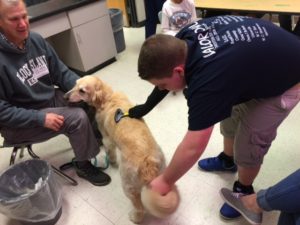 boy playing with dog