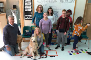 Nellie's schoolhouse meeting with students